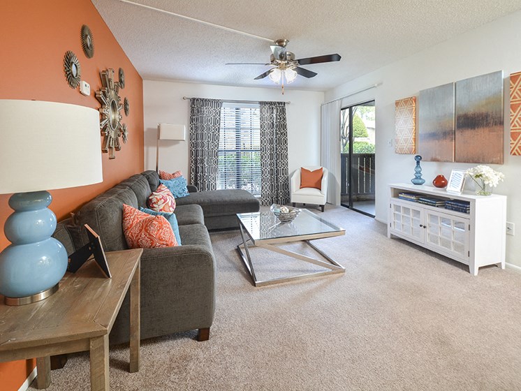 Carpeted Living Room and Ceiling Fan